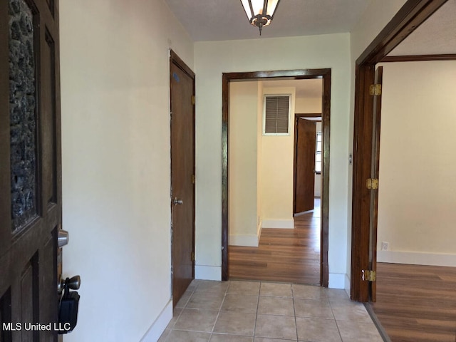 329 Arapaho Ln, Madison, MS 39110 - hallway with light tile patterned floors and baseboards