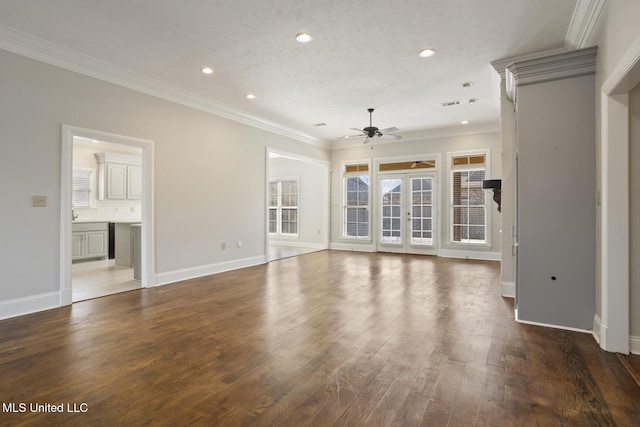 unfurnished living room featuring baseboards, ceiling fan, ornamental molding, wood finished floors, and recessed lighting