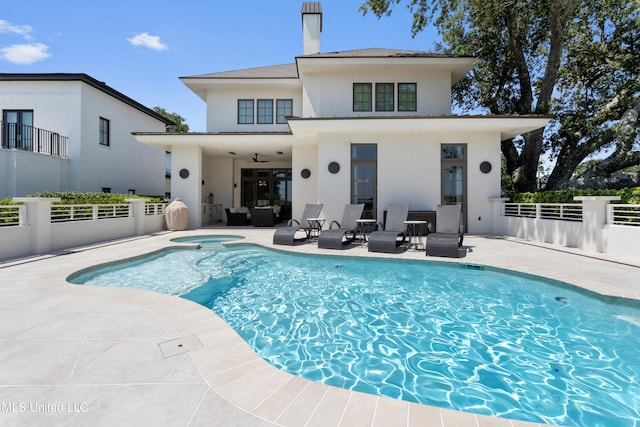 rear view of house with a patio area and ceiling fan