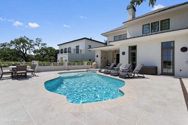 view of pool featuring a patio