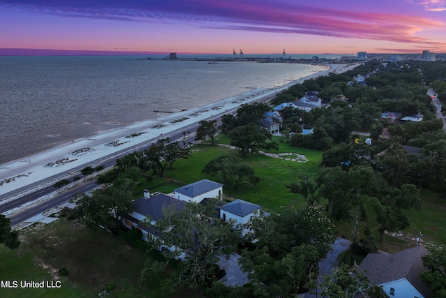 aerial view at dusk with a water view