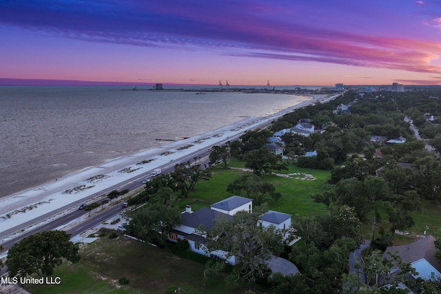 aerial view at dusk with a water view