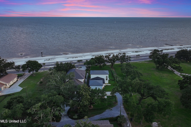 aerial view at dusk with a water view