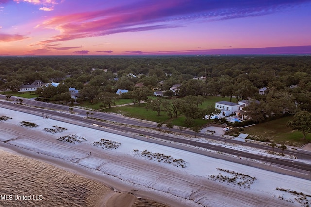 aerial view at dusk with a water view