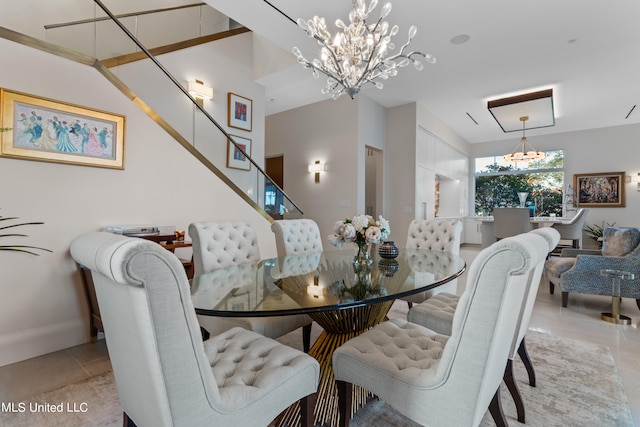 tiled dining space with a chandelier