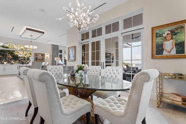 tiled dining space with a notable chandelier