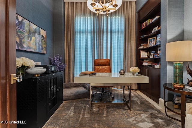 office area with an inviting chandelier and built in features