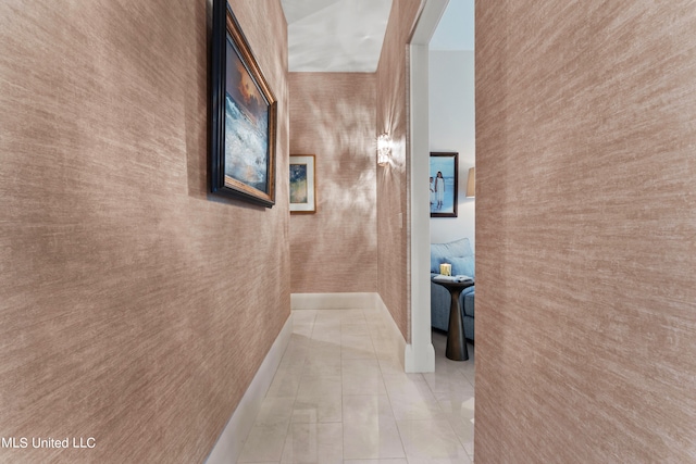 corridor with light tile patterned flooring