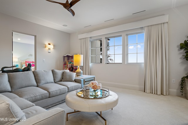 carpeted living room featuring ceiling fan