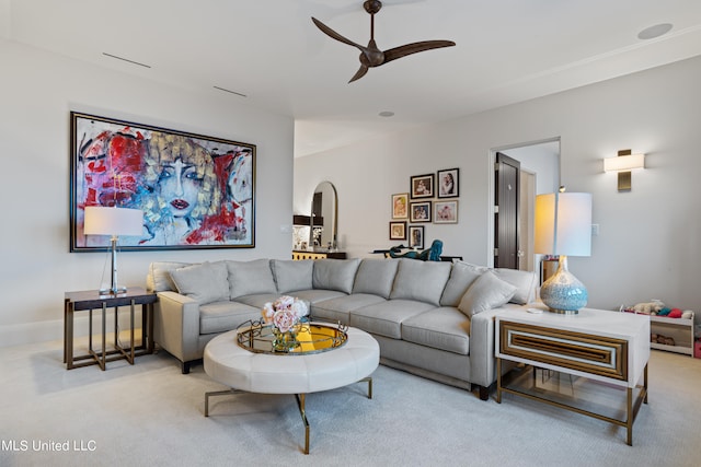 carpeted living room with ceiling fan