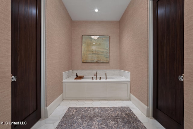 bathroom featuring a bathtub and tile patterned flooring