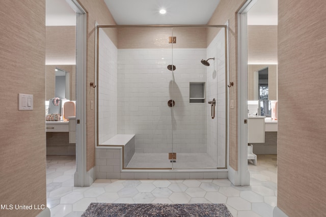 bathroom with vanity, a shower with shower door, and tile patterned flooring