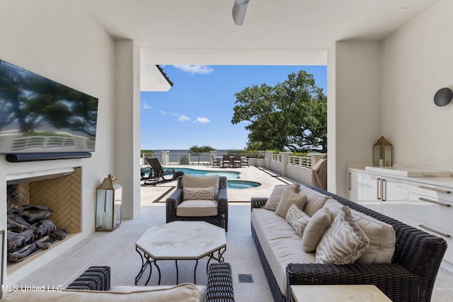 view of patio / terrace featuring an outdoor hangout area and a fenced in pool