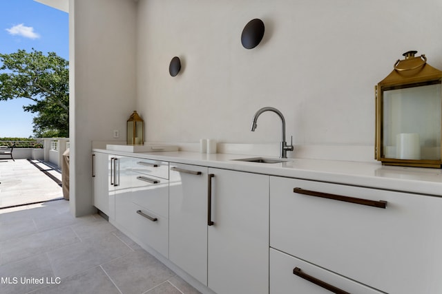 interior space with vanity and tile patterned floors