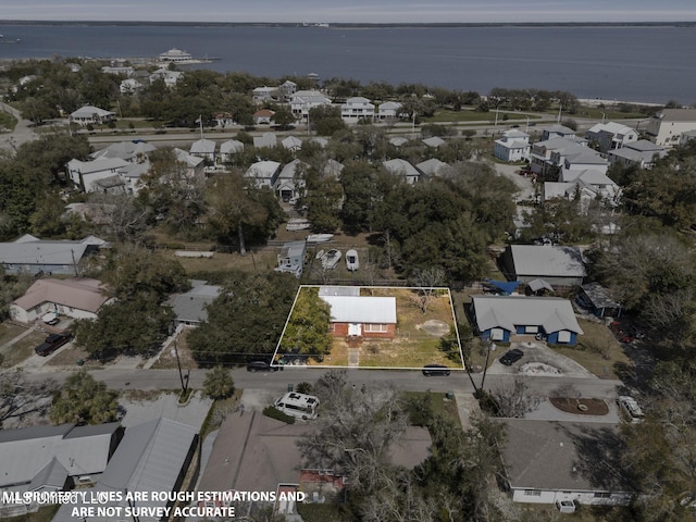 bird's eye view featuring a residential view and a water view