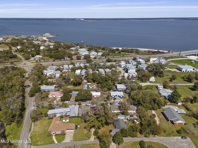 birds eye view of property with a water view and a residential view