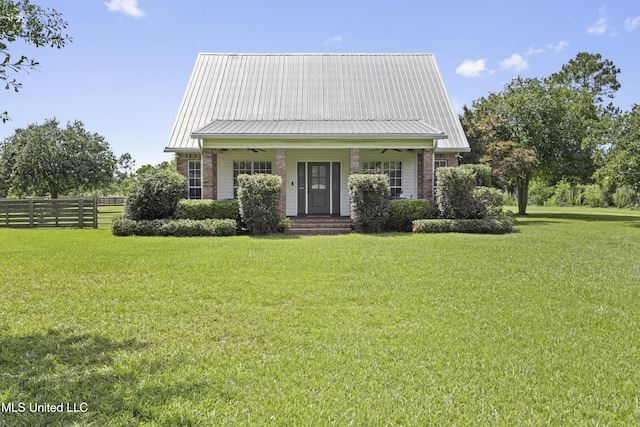 12219 County Farm Rd, Gulfport, MS 39503 - view of front of house featuring a metal roof and a porch