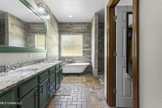 12219 County Farm Rd, Gulfport, MS 39503 - full bath featuring a freestanding tub, brick floors, double vanity, and tile walls