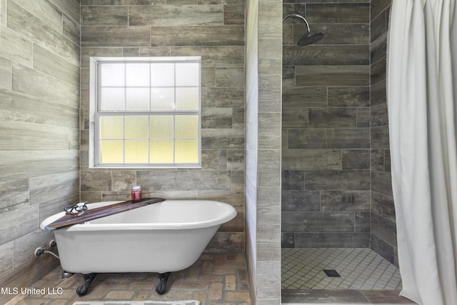 12219 County Farm Rd, Gulfport, MS 39503 - bathroom with a shower stall and a soaking tub