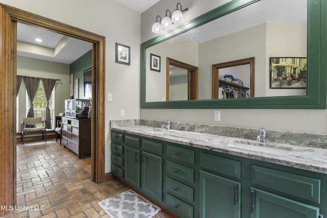 12219 County Farm Rd, Gulfport, MS 39503 - bathroom featuring brick floors, double vanity, and a spacious closet