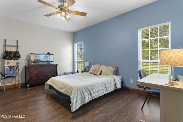 12219 County Farm Rd, Gulfport, MS 39503 - bedroom with multiple windows, dark wood-style floors, a desk, and ceiling fan