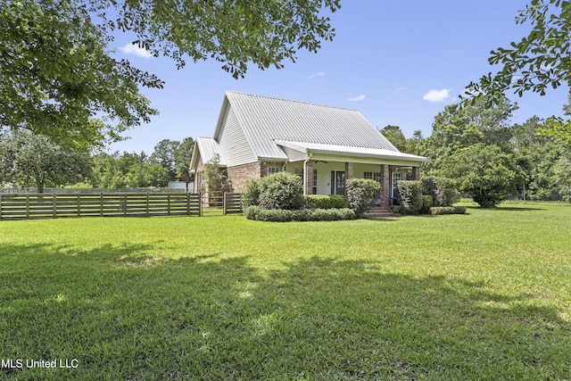 12219 County Farm Rd, Gulfport, MS 39503 - view of home's exterior with covered porch and a metal roof