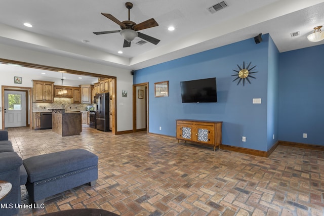 12219 County Farm Rd, Gulfport, MS 39503 - living room with ceiling fan, recessed lighting, and brick flooring