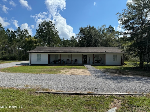 ranch-style home with a porch and a front lawn