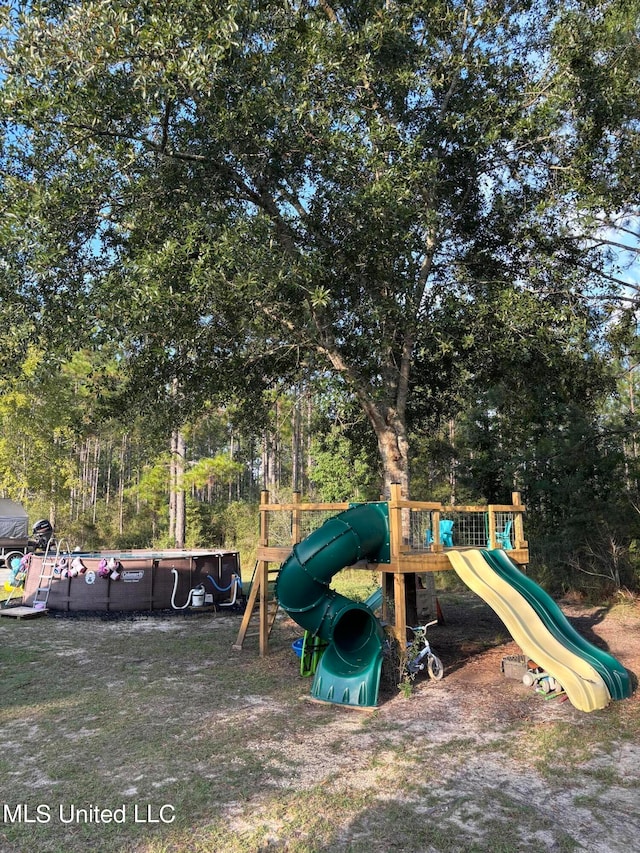 view of play area featuring a swimming pool