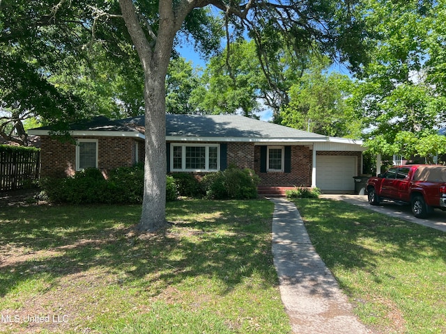 ranch-style house with a front yard and a garage