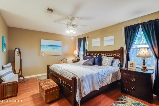 109 Palm Ave, Pass Christian, MS 39571 - bedroom featuring wood finished floors, baseboards, and a ceiling fan