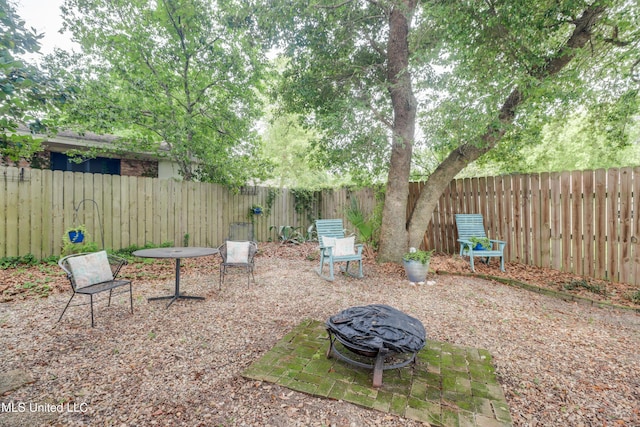 109 Palm Ave, Pass Christian, MS 39571 - fenced backyard with an outdoor fire pit