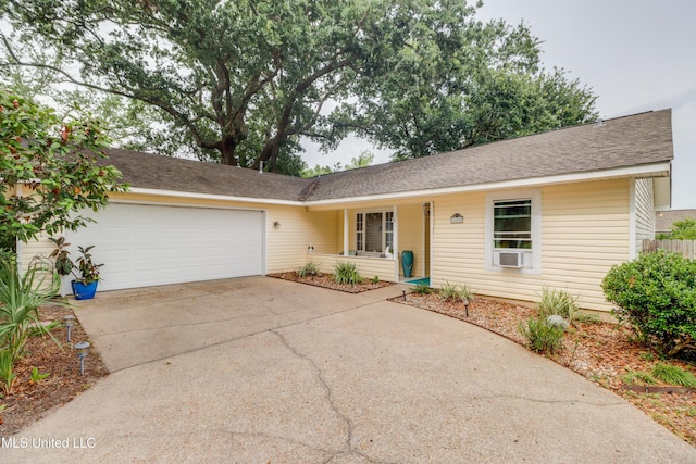 109 Palm Ave, Pass Christian, MS 39571 - single story home with an attached garage, driveway, and roof with shingles