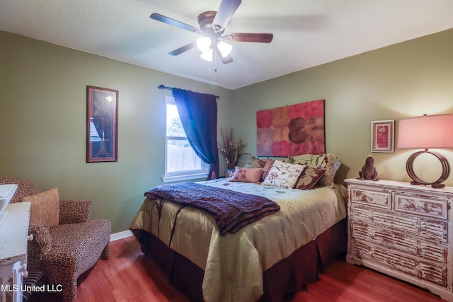 109 Palm Ave, Pass Christian, MS 39571 - bedroom featuring wood finished floors, a ceiling fan, and baseboards