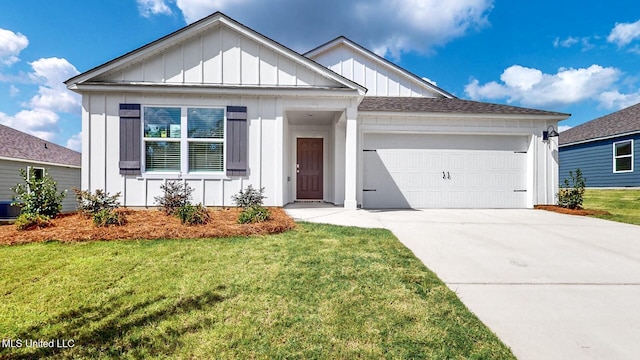 169 Mill Ct, Lucedale, MS 39452 - view of front of house featuring board and batten siding, a garage, concrete driveway, and a front yard