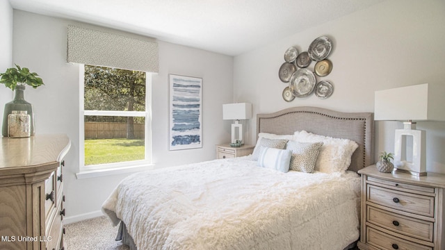 169 Mill Ct, Lucedale, MS 39452 - carpeted bedroom featuring multiple windows