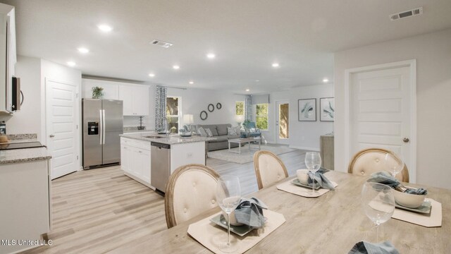 169 Mill Ct, Lucedale, MS 39452 - dining space with light wood-type flooring and recessed lighting