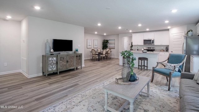 169 Mill Ct, Lucedale, MS 39452 - living room with light wood finished floors and recessed lighting