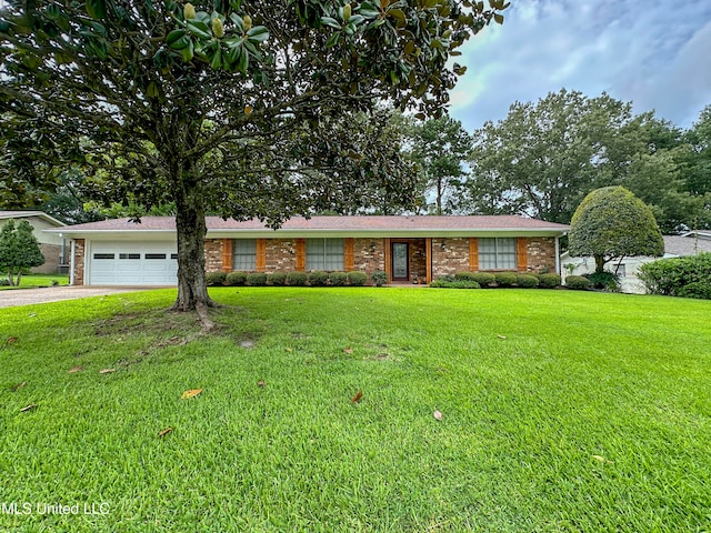 ranch-style home featuring a garage and a front lawn