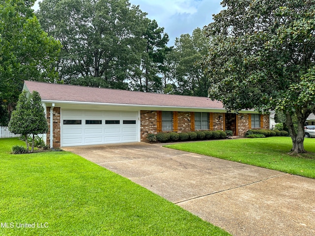 ranch-style house with a garage and a front lawn