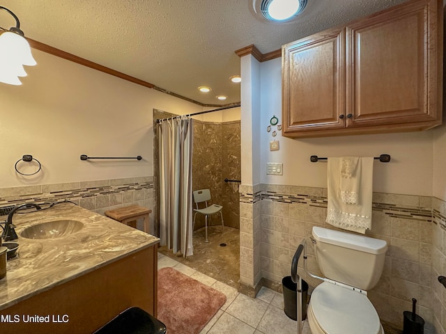 bathroom featuring vanity, tile walls, toilet, and walk in shower