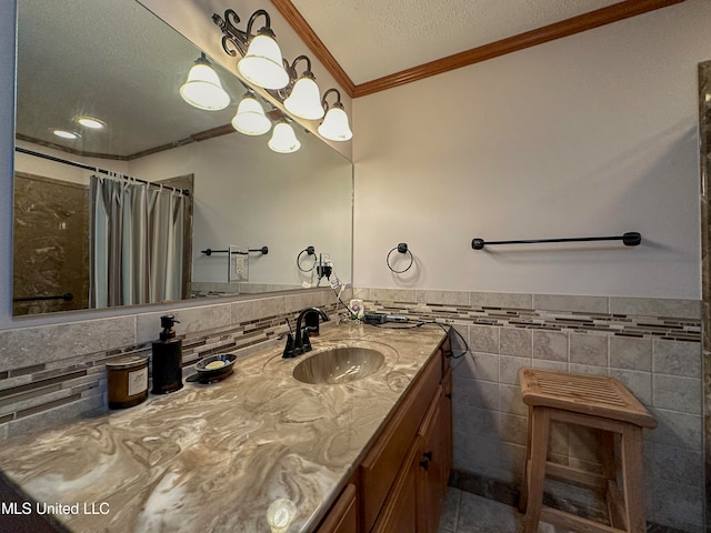 bathroom with vanity, crown molding, a shower with shower curtain, and tile walls