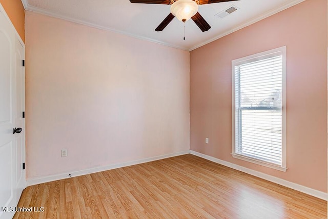 empty room with ceiling fan, light wood-type flooring, plenty of natural light, and crown molding