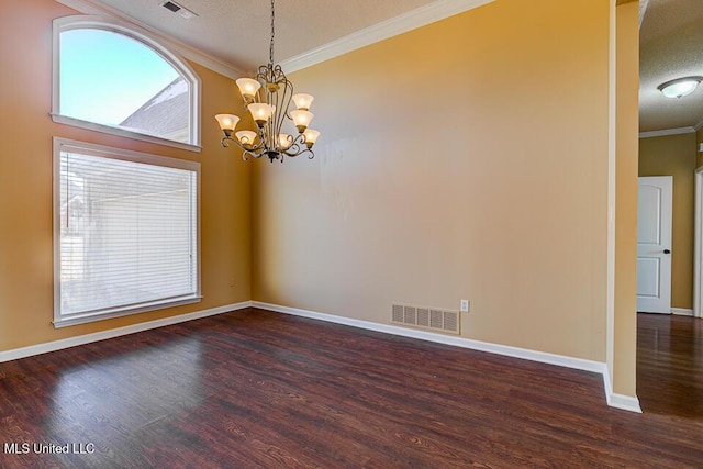 unfurnished room with dark wood-type flooring, a healthy amount of sunlight, and an inviting chandelier