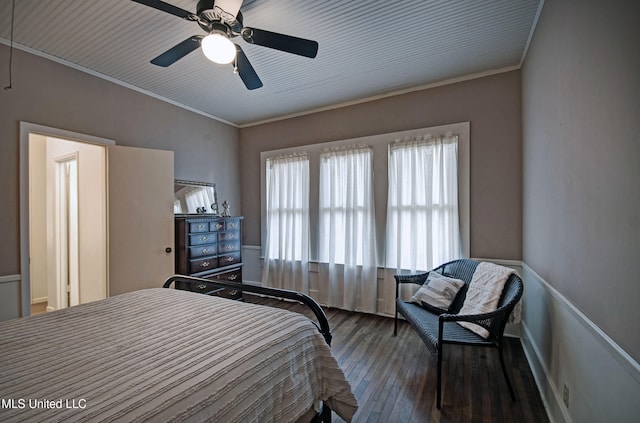 bedroom with wood-type flooring, ceiling fan, and crown molding