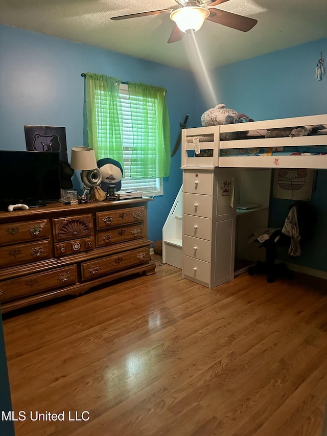 8215 Whitehead Dr, Southaven, MS 38671 - bedroom with wood finished floors and ceiling fan