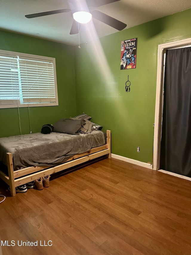 8215 Whitehead Dr, Southaven, MS 38671 - bedroom featuring wood finished floors and ceiling fan