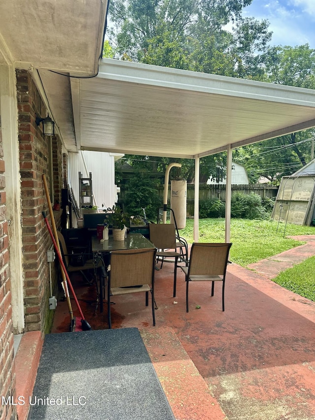8215 Whitehead Dr, Southaven, MS 38671 - view of patio / terrace with an exterior structure and an outbuilding