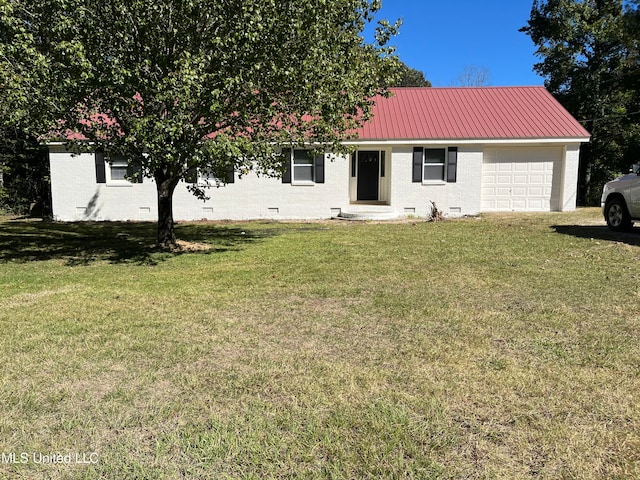 view of front of home with a garage and a front lawn