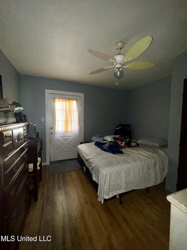 bedroom featuring ceiling fan and wood finished floors